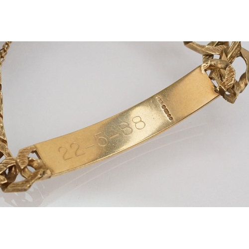 211 - 9ct gold identification bracelet with flat curb links and safety chain. Hallmarked London 1988. Brac... 