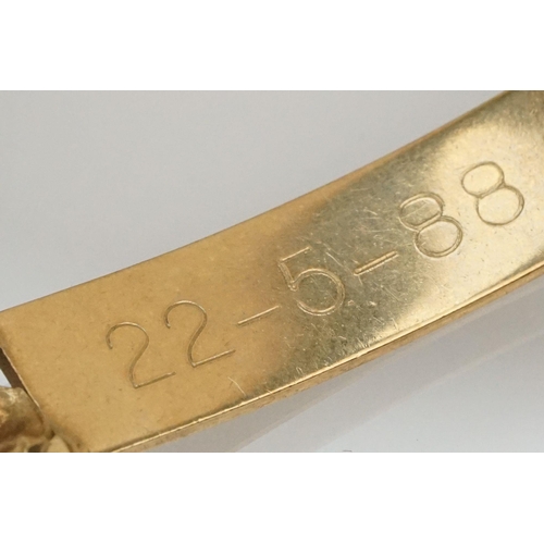 211 - 9ct gold identification bracelet with flat curb links and safety chain. Hallmarked London 1988. Brac... 