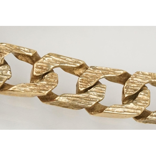 211 - 9ct gold identification bracelet with flat curb links and safety chain. Hallmarked London 1988. Brac... 