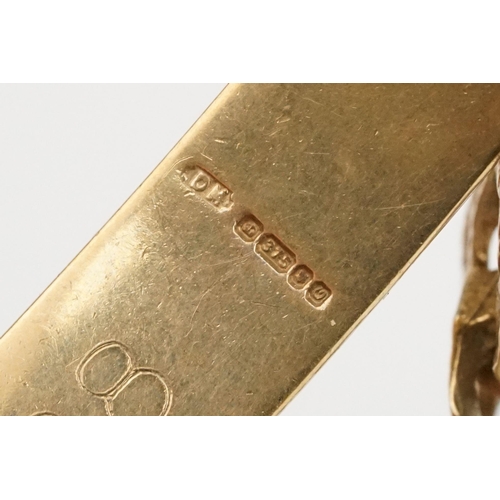 211 - 9ct gold identification bracelet with flat curb links and safety chain. Hallmarked London 1988. Brac... 