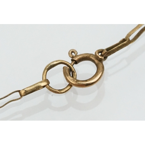 213 - 9ct gold 'T' pendant necklace having an elongated chain with spring ring clasp. Chain hallmarked to ... 