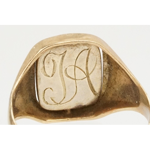 214 - 9ct gold signet ring having a blue enamelled Masonic panel swivelling to reveal engraved initials to... 