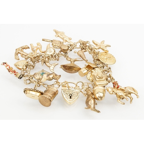 215 - 9ct gold double link bracelet with heart padlock clasp, having 21 charms. 19 charms marked 9ct or ha... 