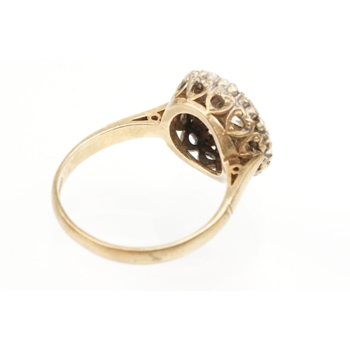 217 - 9ct gold and cz cluster ring set with a round cut cz to centre with a halo of further stones. Hallma... 