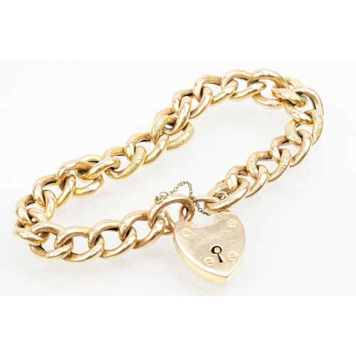 22 - 9ct gold curb link bracelet with heart clasp. Heart clasp marked 9ct. Measures 8 inches.