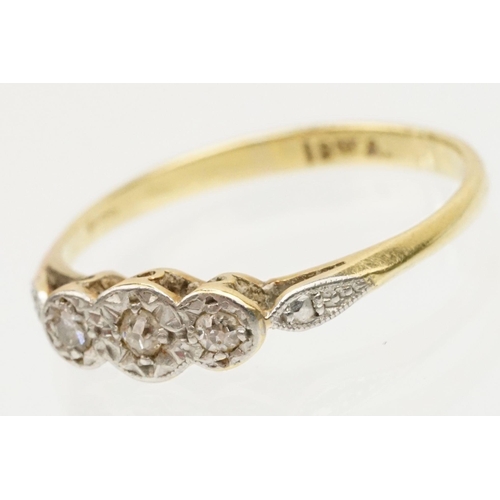 229 - Group of three gold rings to include an 18ct and platinum three stone ring (marked 18ct, size L.5), ... 