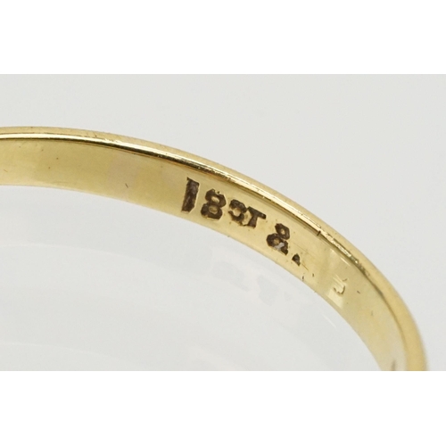 229 - Group of three gold rings to include an 18ct and platinum three stone ring (marked 18ct, size L.5), ... 