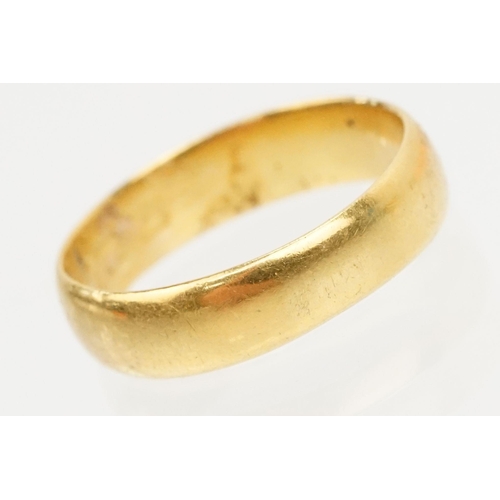 230 - Two gold wedding band rings to include a a hallmarked 22ct ring (Birmingham 1914, size K), and anoth... 