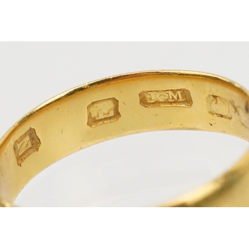 230 - Two gold wedding band rings to include a a hallmarked 22ct ring (Birmingham 1914, size K), and anoth... 