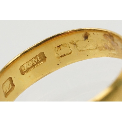 230 - Two gold wedding band rings to include a a hallmarked 22ct ring (Birmingham 1914, size K), and anoth... 