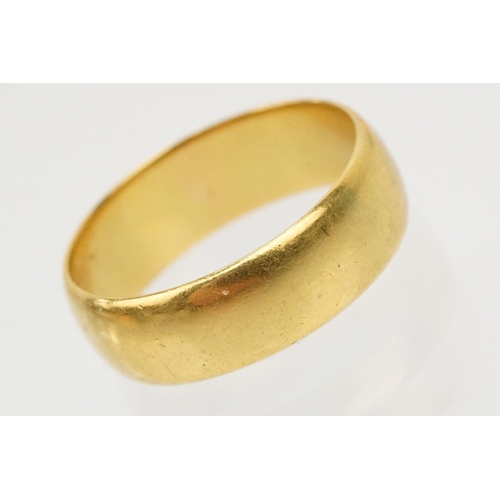 230 - Two gold wedding band rings to include a a hallmarked 22ct ring (Birmingham 1914, size K), and anoth... 