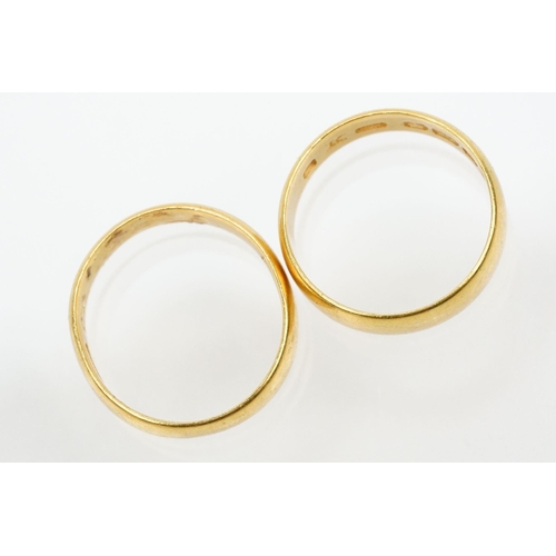 230 - Two gold wedding band rings to include a a hallmarked 22ct ring (Birmingham 1914, size K), and anoth... 