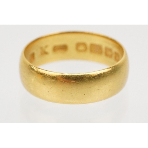 230 - Two gold wedding band rings to include a a hallmarked 22ct ring (Birmingham 1914, size K), and anoth... 