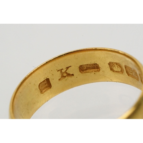 230 - Two gold wedding band rings to include a a hallmarked 22ct ring (Birmingham 1914, size K), and anoth... 