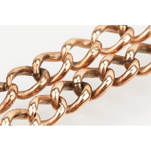 231 - 9ct rose gold curb link bracelet with spring ring clasp. Marked 9ct to clasp. Measures 8 inches.