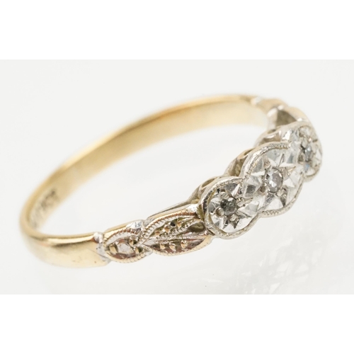 235 - 18ct gold and platinum three stone ring. The ring being illusion set with three round cut diamonds (... 