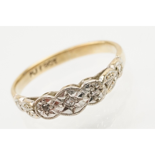 235 - 18ct gold and platinum three stone ring. The ring being illusion set with three round cut diamonds (... 