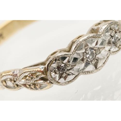 235 - 18ct gold and platinum three stone ring. The ring being illusion set with three round cut diamonds (... 