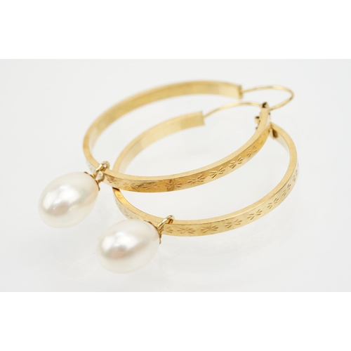 241 - Pair of 9ct gold hoop earrings with cultured pearl drops. Italian hallmarks to inner hoop. Measures ... 