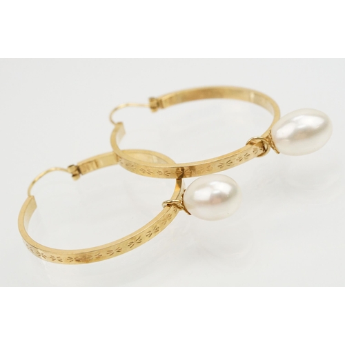 241 - Pair of 9ct gold hoop earrings with cultured pearl drops. Italian hallmarks to inner hoop. Measures ... 