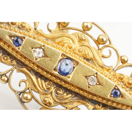 29 - Victorian 15ct gold sapphire and diamond brooch. The brooch of navette form with scrolled details wi... 