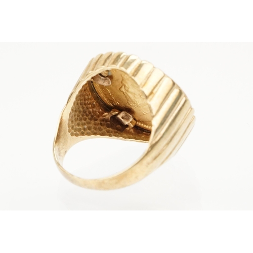 42 - 9ct gold ring set with a 1/10 oz 1938 Krugerrand coin. The ring with reeded details. Hallmarked Lond... 