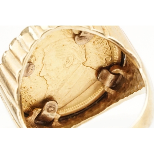 42 - 9ct gold ring set with a 1/10 oz 1938 Krugerrand coin. The ring with reeded details. Hallmarked Lond... 