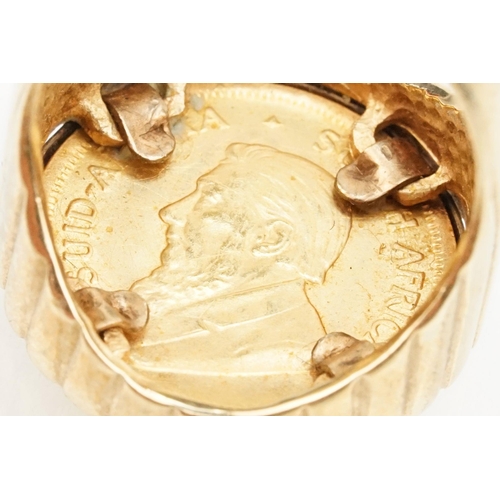 42 - 9ct gold ring set with a 1/10 oz 1938 Krugerrand coin. The ring with reeded details. Hallmarked Lond... 