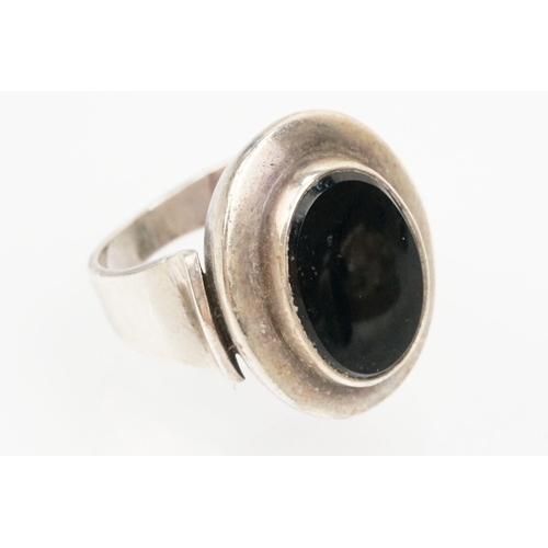 84 - Group of four Scandinavian silver mid 20th Century rings to include an N E From Danish black stone r... 