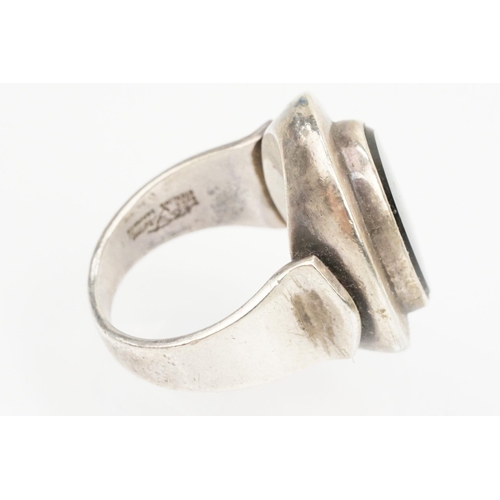 84 - Group of four Scandinavian silver mid 20th Century rings to include an N E From Danish black stone r... 