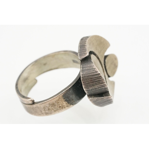 84 - Group of four Scandinavian silver mid 20th Century rings to include an N E From Danish black stone r... 