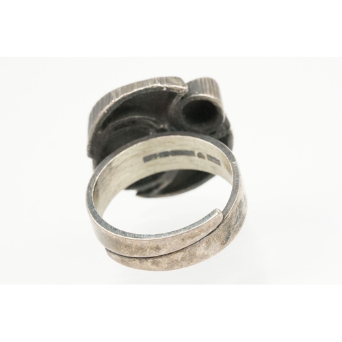 84 - Group of four Scandinavian silver mid 20th Century rings to include an N E From Danish black stone r... 