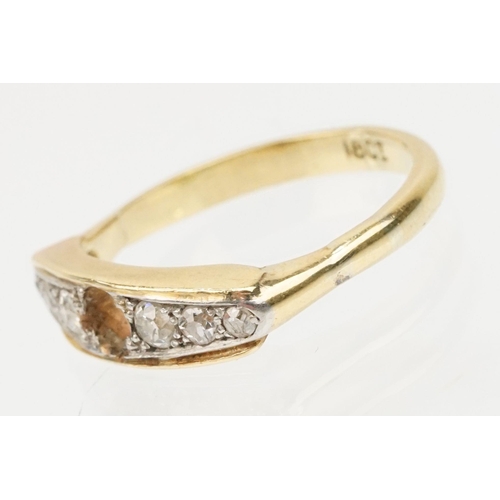 85 - 18ct gold and diamond ring. The ring being set with six round old cut diamonds with central stone mi... 