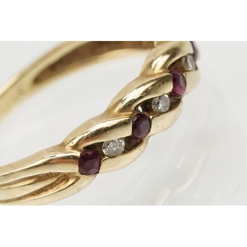 88 - 9ct gold ruby and diamond ring of woven design set with alternate round cut rubies and diamonds. Mar... 