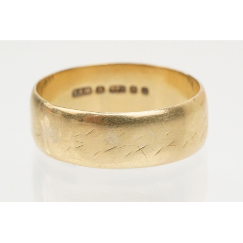 89 - 9ct gold wedding band ring of wide form. Hallmarked London 1979. Size T.