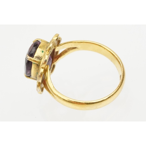 92 - 22ct gold and amethyst ring. The ring being set with an oval mixed cut amethyst in a pierced scallop... 