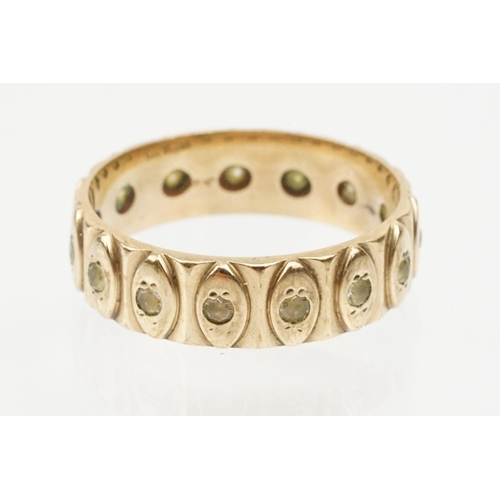 95 - 9ct gold eternity ring having a wide band with marquise moulded details and set with white stones. H... 