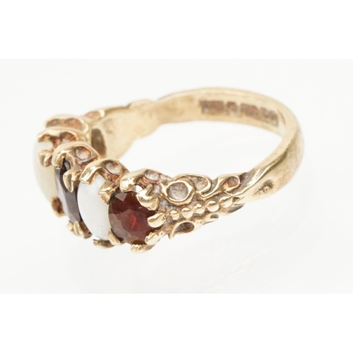 97 - 9ct gold garnet topped doublet and opal five stone ring. The ring being set with three oval cut GTD'... 