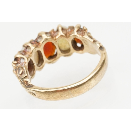 97 - 9ct gold garnet topped doublet and opal five stone ring. The ring being set with three oval cut GTD'... 