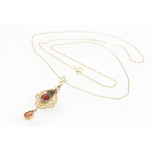 101 - Suite of 9ct gold and garnet jewellery to include a pendant necklace with fine link chain and scroll... 