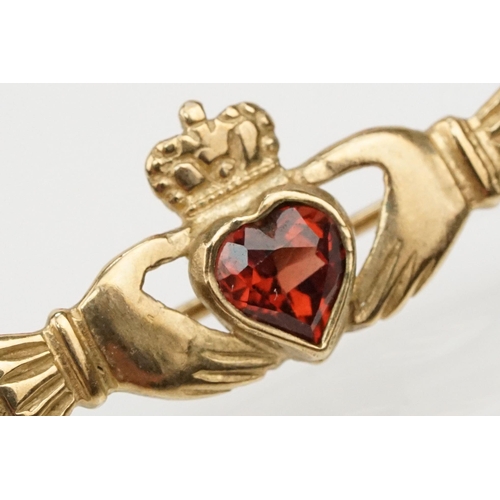 101 - Suite of 9ct gold and garnet jewellery to include a pendant necklace with fine link chain and scroll... 