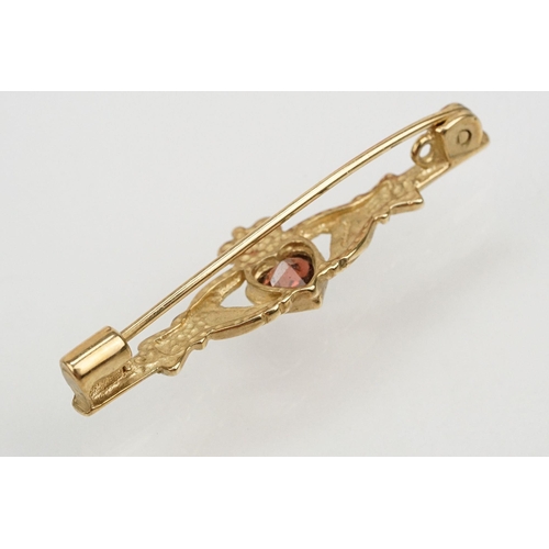 101 - Suite of 9ct gold and garnet jewellery to include a pendant necklace with fine link chain and scroll... 