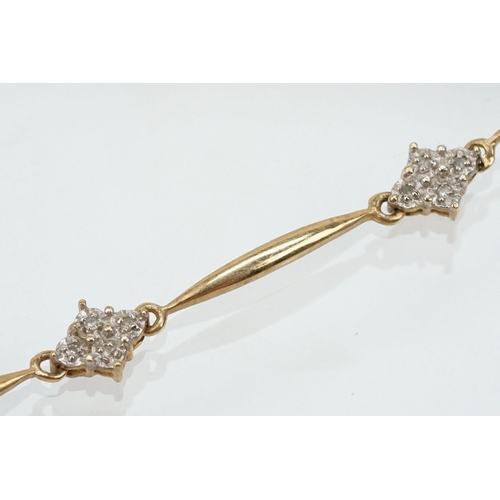 104 - 9ct gold and diamond line bracelet having bar links with diamond clusters. Marked 375. Measures 7.5 ... 