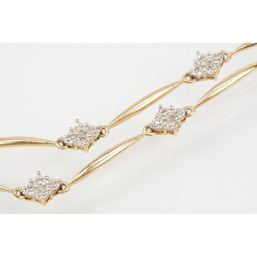 104 - 9ct gold and diamond line bracelet having bar links with diamond clusters. Marked 375. Measures 7.5 ... 