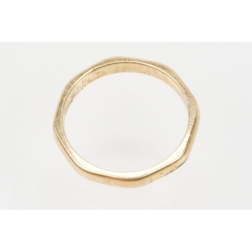 110 - 9ct gold and white stone eternity ring with incised details (marked 9ct, size K) together with a 9ct... 