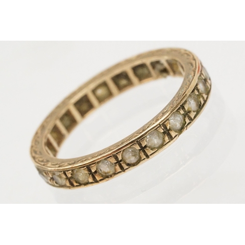 110 - 9ct gold and white stone eternity ring with incised details (marked 9ct, size K) together with a 9ct... 