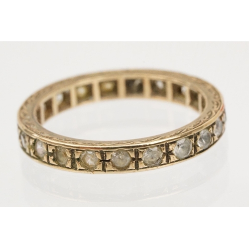 110 - 9ct gold and white stone eternity ring with incised details (marked 9ct, size K) together with a 9ct... 