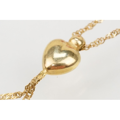 113 - Four 9ct gold pendant necklaces to include a locket pendant on a fine link chain (marked 375 to both... 