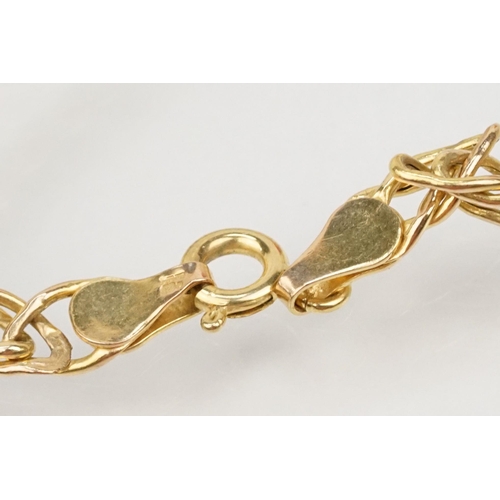 115 - Group of three bracelets to include a 9ct gold open bangle with heart shaped terminals (hallmarked S... 