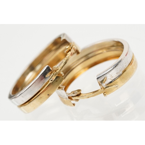 118 - Pair of 9ct gold two tone hoop earrings with hinged posts. Marked 375 to the posts. Measures 1.8cm d... 